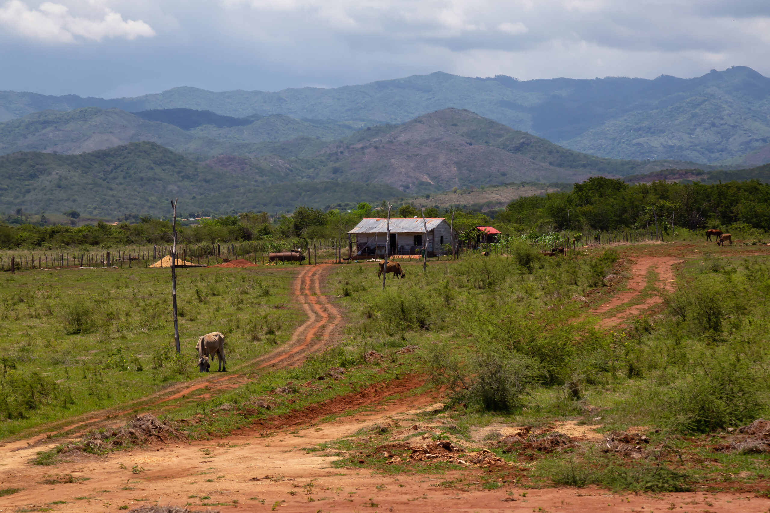 Beautiful view of a farm on the country side with the mountains in the background. Taken near Trinidad, Cuba.